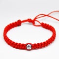 Delicate decorative bracelet woven from red rope