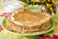 Delicate fishnet pancakes with sour cream.