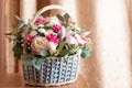 delicate flower arrangement. beautiful bouquet of pink flowers in basket on wooden table. wedding bouquet Royalty Free Stock Photo