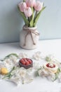 Delicate flowers and sweets. Cute light postcard for Easter, spring holiday, Mother`s Day. Royalty Free Stock Photo