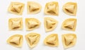 Exquisite Culinary Art: 10 Perfectly Crafted Ravioli on a Minimalist White Background