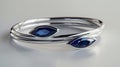 a delicate Indian bangles set adorned with two marquise-cut blue sapphires, elegantly set in 14k white gold, capturing Royalty Free Stock Photo