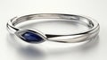 a delicate Indian bangles set adorned with two marquise-cut blue sapphires, elegantly set in 14k white gold, capturing Royalty Free Stock Photo