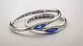 a delicate Indian bangles set adorned with two marquise-cut blue sapphires, elegantly set in 14k white gold, capturing Royalty Free Stock Photo