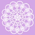 Delicate knitted lace doily isolated on purple background