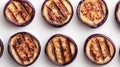 Delicate Lacy Pattern of Grilled Eggplant Slices Arranged in a Loose Spiral on a Bright White Background Royalty Free Stock Photo