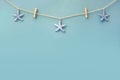 Delicate nautical border with starfish on a background of colourful turquoise blue painted boards with copyspace for