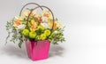 Delicate orchids in a gift box or basket on a light background. Space for text. Bouquet of orchids, roses and chrysanthemums. Royalty Free Stock Photo