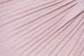 Delicate pink, nude plisse background. geometric cloth lines. Fabric, textile close up