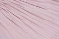 Delicate pink, nude plisse background. geometric cloth lines. Fabric, textile close up