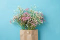 Delicate Pink and White Flowers in a Brown Paper Bag Royalty Free Stock Photo