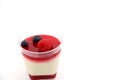 Delicate raspberry panacotta decorated with fresh fruit. Royalty Free Stock Photo