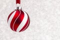 Delicate Red and White Glittery Christmas Ornament Hanging on a Royalty Free Stock Photo