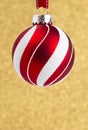 Delicate Red and White Glittery Christmas Ornament Hanging on a Royalty Free Stock Photo