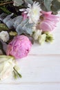 Delicate romantic bouquet for a gift. Huge pink peonies and white roses on a white background.