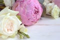 Delicate romantic bouquet for a gift. Huge pink peonies and white roses on a white background. Royalty Free Stock Photo