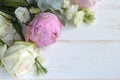 Delicate romantic bouquet for a gift. Huge pink peonies and white roses on a white background.