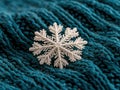 Delicate snowflake on cozy knitted fabric