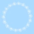 Delicate snowflake wreath on a soft blue background Royalty Free Stock Photo