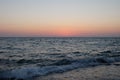 Delicate sunset on the pebble sea.