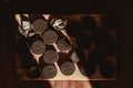 Delicate sweet chocolate oreo cookies on a wooden table on a beautiful sunny day