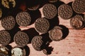 Delicate sweet chocolate oreo cookies on a wooden table on a beautiful sunny day