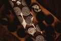 Delicate sweet chocolate oreo cookies on a wooden table on a beautiful sunny day