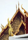 Delicate Thai art at roof top of Buddhist temple in Bangkok, Tha