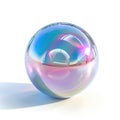 A delicate, translucent sphere with a holographic finish captures and refracts light