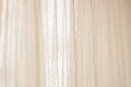Delicate tulle with vertical threads pattern, side view