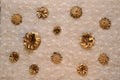 Delicate warm background of pine gilded cones on knitted patterned down canvas