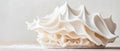 Delicate white meringue swirls with fine powder against a soft light background, representing creative culinary textures. Royalty Free Stock Photo