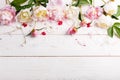 Delicate white pink peony with petals flowers and white ribbon on wooden board. Overhead top view, flat lay. Copy space. Birthday, Royalty Free Stock Photo