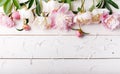 Delicate white pink peony with petals flowers and white ribbon on wooden board. Overhead top view, flat lay. Copy space. Birthday, Royalty Free Stock Photo