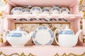 Delicate white porcelain china tea set with a selection of saucers, cups and teapots Royalty Free Stock Photo