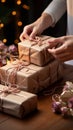 Delicate wrapping: Close-up reveals confectioner\'s hands carefully adorning cardboard box with finesse.