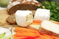 Delicatessen cheese on cut board Royalty Free Stock Photo