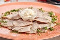 Delicatessen restaurant dish of thinly sliced boiled beef tongue