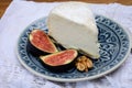 Delice de Bourgogne French cow`s milk cheese from Burgundy region of France served with fresh figs and walnuts