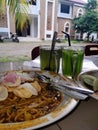 delicious Acehnese noodle dishes accompanied by fresh green tea drinks Royalty Free Stock Photo