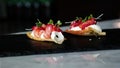 Delicious amuse bouche appetizer, cured salmon with beetroot, chess and orange blossom Royalty Free Stock Photo