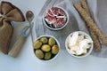 Delicious antipasto catering platter with different meat and cheese products. cheese, olives and ham for a simple breakfast. linen Royalty Free Stock Photo