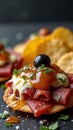 Delicious appetizer with cured meat, cheese, and olives on crispy cracker Royalty Free Stock Photo