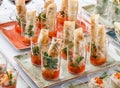 Delicious appetizers in glass cups on banquet table. Catering food, canape and snacks