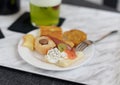 Delicious appetizers on white marble background