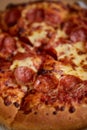 Pepperoni pizza closeup with selective focus Royalty Free Stock Photo