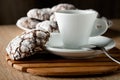 Delicious appetizing chocolate cookies cracked on a plate on a w