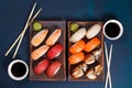 Delicious appetizing nigiri sushi set, served on clay plates wit Royalty Free Stock Photo