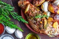 Delicious and appetizing roasted pork tenderloin with spices and potatoes black pepper, olive oil, garlic, fresh rosemary, salt