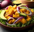 Delicious and appetizing salad of mango, avocado, red onions and lettuce.